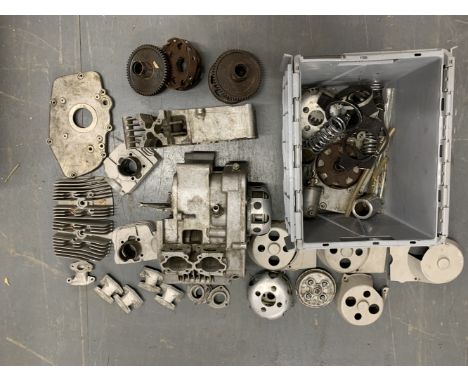 A selection of Tohatsu engine componentsincluding crankcases (unnumbered); cylinder barrels; cylinder heads; carburettor mani