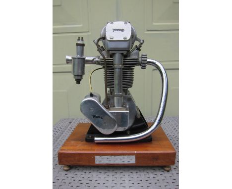 A model Norton International enginemounted on a wooden plinth, 28.5cm high (plus plinth) bearing a plaque stating 'A Working 