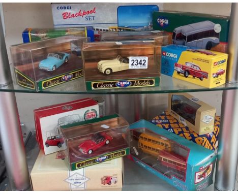 2 shelves of Corgi classics including MGA Jaguar triumph &amp; Mini cooper etc 