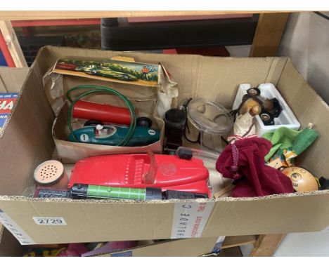 A battery operated Vanwall, Marx fire chef car, Pelham puppet etc