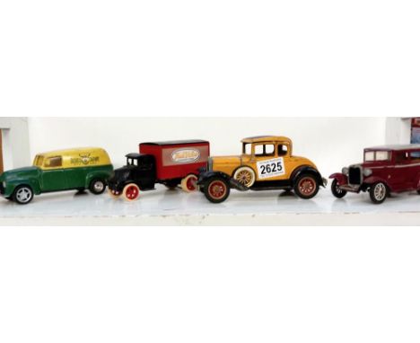 A Diecast Hubley model A Ford &amp; 2 ERTL van money boxes &amp; a plastic Ford 