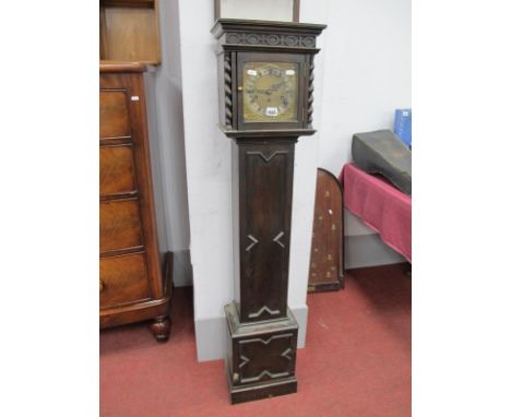 A 1930's Oak Grandmother Clock, hand with a blind fret, meze, barley twist supports, square dial, with a silver chapter ring,