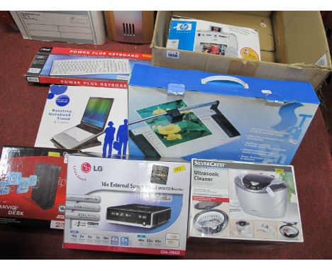 A4 Paper Trimmer, rotation notebook stand, photosmart printer, multi DVD / CD rewriter, desktop hard drives, Trust keyboard, 