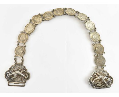 An Indian white metal sari belt, the clasp decorated with figures, length 59cm. 