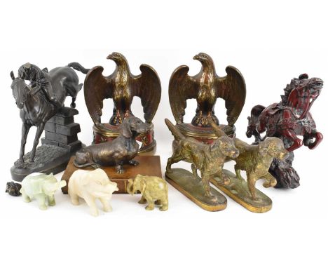 A group of decorative modern spelter and resin figures, including a pair of brass figures of dogs, a spelter figure of a saus