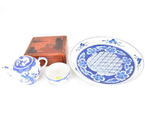 A large 20th century Japanese porcelain bowl with floral and cross-hatched pattern, wavy edge, with three-character marks to 