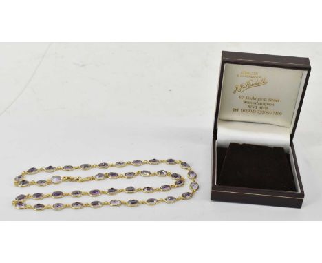 An 18ct yellow gold amethyst necklet comprising forty-two oval individually set stones, length 60cm, approx 19.5g.