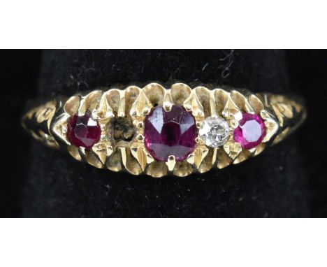 A yellow metal diamond and ruby set ring set with three small rubies and one diamond (one diamond missing), size P, approx 2.