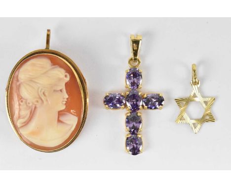 A yellow metal cameo brooch, 14ct yellow gold and amethyst set cross pendant and a 9ct yellow gold Star of David pendant. 