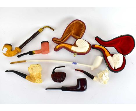 A group of eight pipes including two leather cased pipes, a Barling pipe, a Keens pipe, a Harrods pipe and a leather pipe cas