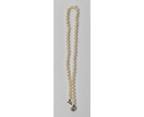 A 9ct white gold mounted pearl necklace set with small white stones and large central orange stone, length 52cm.