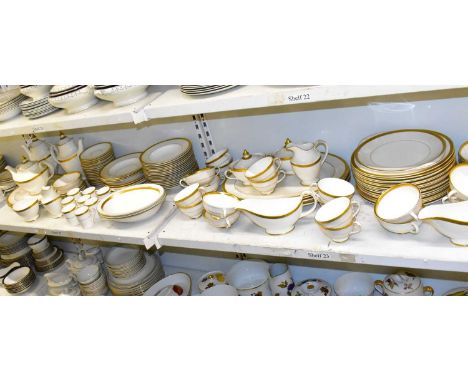 ROYAL DOULTON; an extensive tea and dinner service decorated in the 'Royal Gold' H.4980 pattern, comprising five tureens, fou