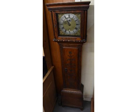 An early 20th century oak cased longcase clock, the brass face set with silvered chapter ring with Roman numerals, height 188