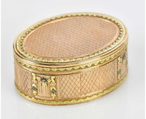 A fine late 18th/early 19th century three colour gold snuff box of oval form, with engine turned and applied floral motifs, w
