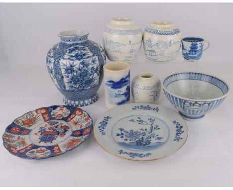 Nine antique and modern Chinese and Japanese porcelain pieces to include a set of three ginger jars with landscape scenes, ta