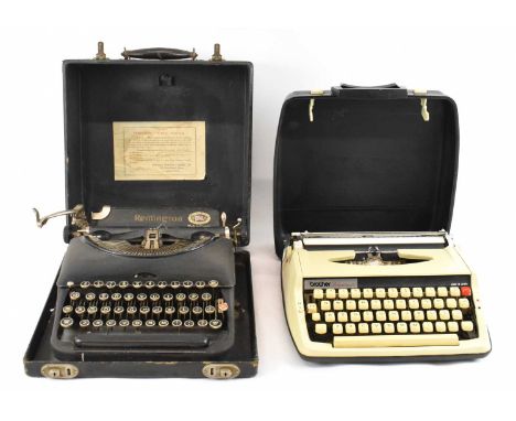 A cased Remington typewriter and another cased typewriter (2). 