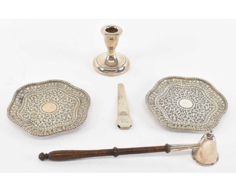 A modern hallmarked silver candle snuffer, Sheffield 1991, length 24cm, a pair of white metal pierced pin dishes, diameter 12