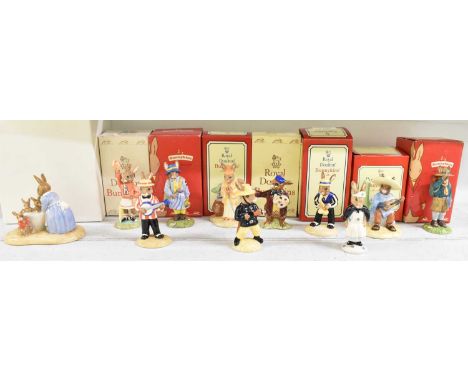 ROYAL DOULTON; a group of eleven boxed Bunnykins figures including the 'Artist', 'Nurse', 'Fireman', 'Cheerleader' (red), 'Ba