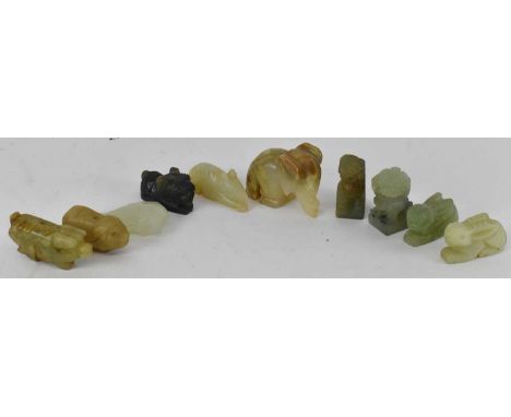 A group of ten Chinese carved hardstone and soapstone figures including a carved hardstone fish, pair of Dogs of Fo, two pigs