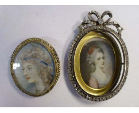 A late 19thC silver coloured metal framed and paste set oval portrait miniature, a young woman wearing a pink, lace trimmed d