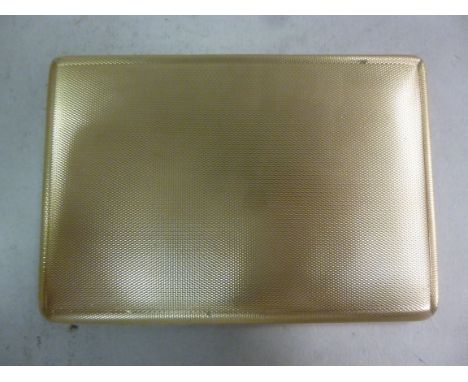 A 1930s 9ct gold cigarette case, the exterior with allover engine turned decoration and a sliding catch  William Neale & Son 