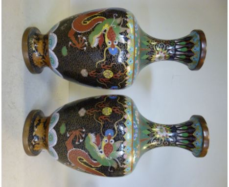 A pair of early 20thC Japanese cloisonne shouldered, ovoid shaped vases, having narrow necks and flared, cup rims, decorated 