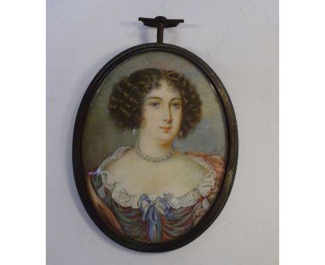 An early 19thC oval head and shoulders portrait miniature, a young woman, her hair in ringlets  bears the initials RP and a y