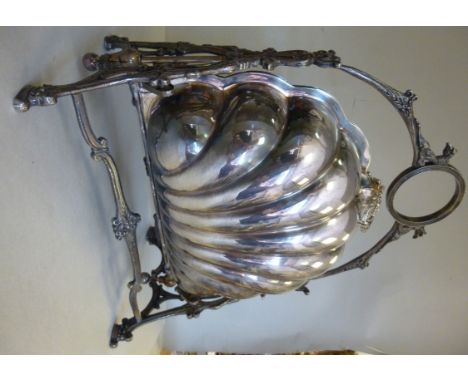 An Edwardian Cassetti silver plated biscuit box, having twin fold down, shell shaped containers with decoratively pierced cov