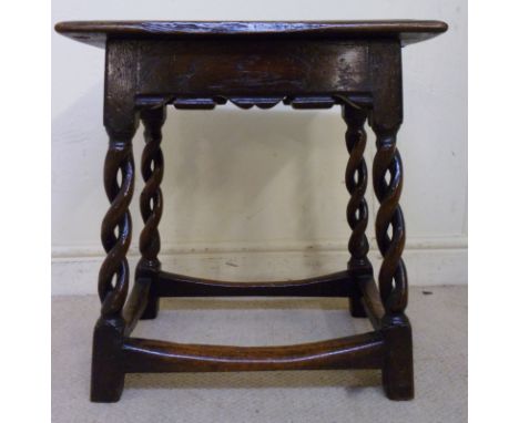 A 19thC oak joint stool, the top having a moulded edge, over a shaped frieze and cotton twist columns, raised on block feet, 