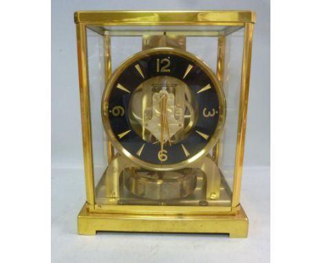 A Jaeger-LeCoultre Atmos clock, in a fully glazed lacquered brass case, model 526, the top plate stamped 99216  8.75''h with 