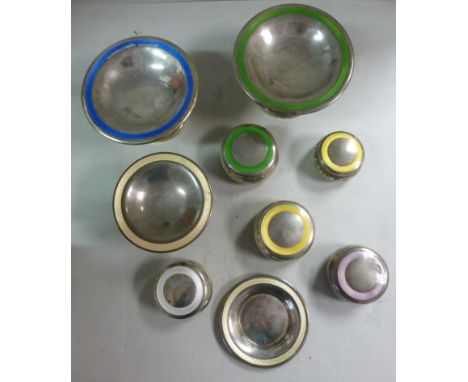 A set of nine Edwardian silver dressing table accessories, each decorated with a band of various coloured enamel  comprising 