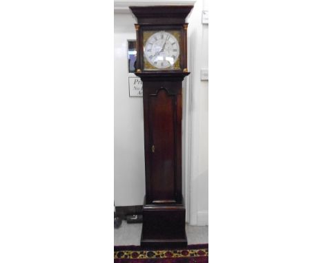 A late 18thC oak longcase clock, the hood having a moulded cornice, over turned columns and an arched door, on a boxed base a