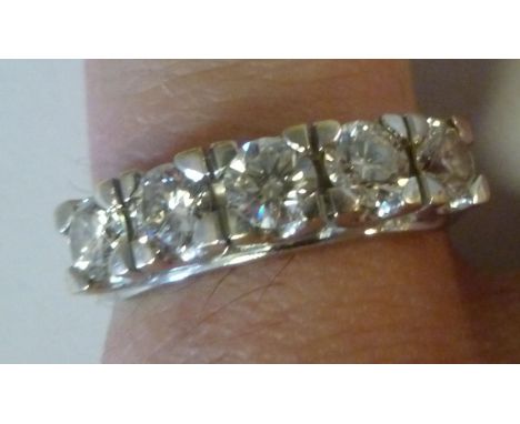 An 18ct gold half eternity ring, set with five brilliant cut diamonds