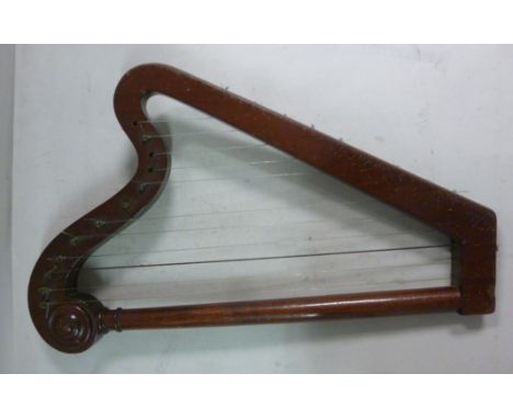 A late 19th/early 20thC miniature mahogany harp with a turned column and steel tuning pins  15.5''h