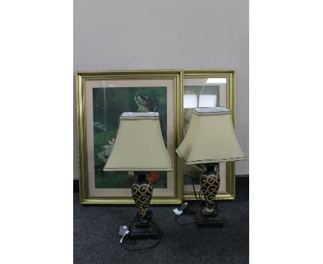 A pair of gilt framed lithographic prints and a pair of table lamps 