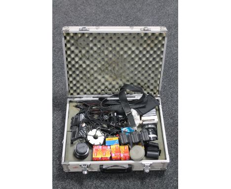 An aluminium case of Ricoh KR-10 Super camera with lens, lenses, accessories and film 