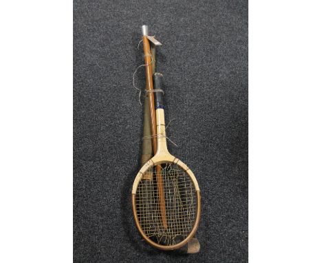 A walking cane with silver pommel, a vintage hockey stick and tennis racket 
