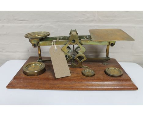 A set of Victorian brass postal scales with weights 