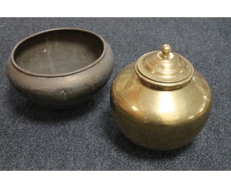 A brass lidded pot and a brass planter 