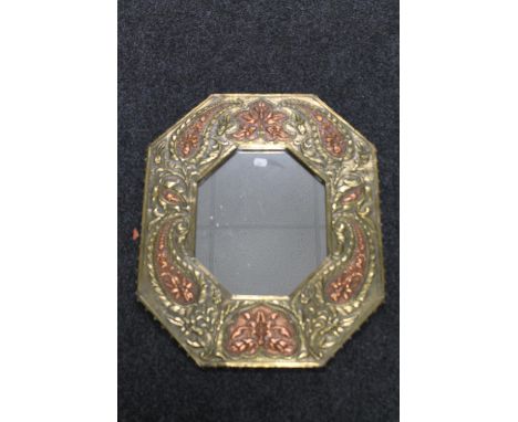 A copper and brass octagonal Arts &amp; Crafts framed mirror 
