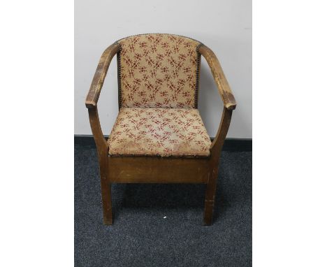 A mid 20th century commode armchair 
