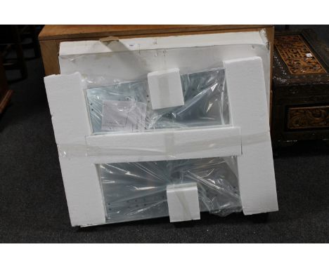 A boxed LED backlit bathroom mirror 