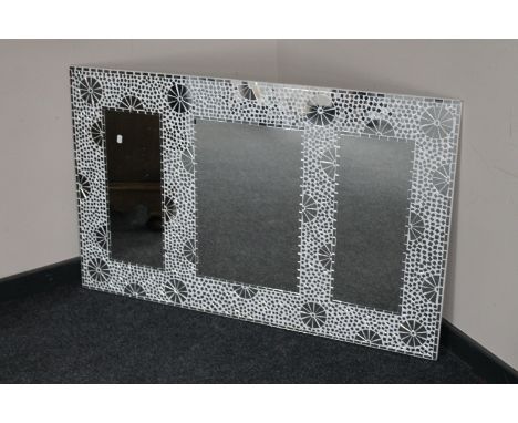 A frameless mosaic mirror 