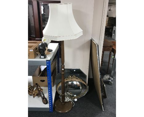 A standard lamp with shade and four assorted mirrors 