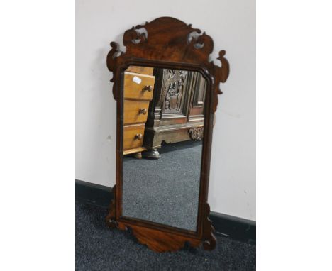 An antique Chippendale style wall mirror 