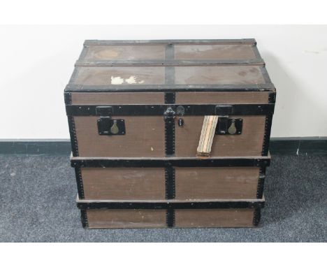A wooden bound shipping trunk 
