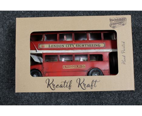 A boxed tin plate tractor 