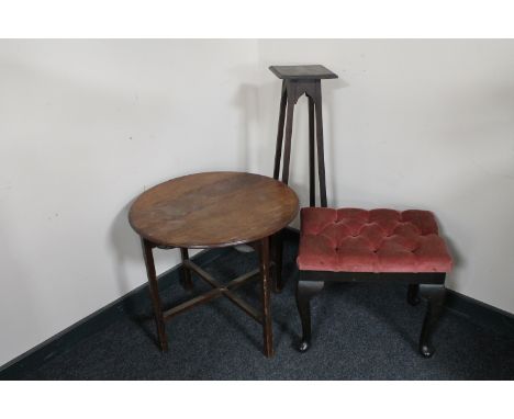A pink dralon upholstered dressing table stool together with a circular oak occasional table and an oak plant stand 