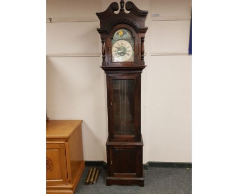 A 20th century stained pine longcase clock with moonphase dial, height 215cm