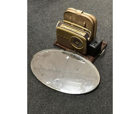 An early 20th century brass framed mirror, twin handled serving tray, Bush radio, ensign E29 camera and a cased typewriter 